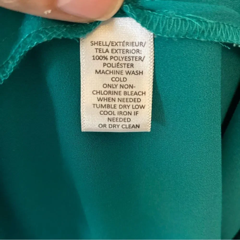 Ann Taylor Loft green jewel toned blouse with cut out detail size S.